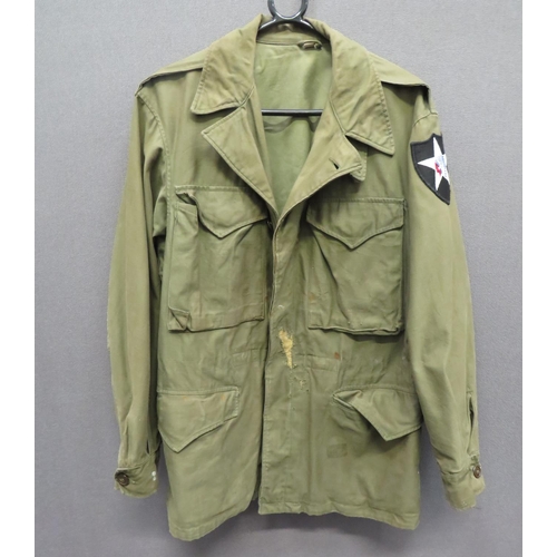 355 - American M1943 Field Jacket
green, heavy cotton, single breasted jacket. &nbsp;The front fastened by... 