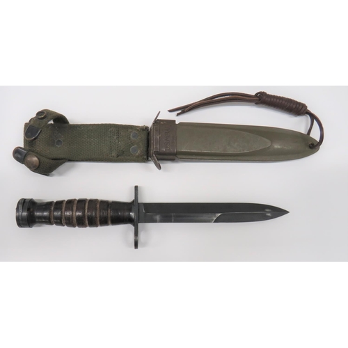 78 - American M4 Knife Bayonet By Camillus
6 3/4 inch, single edged, blued blade with back edge sharpened... 