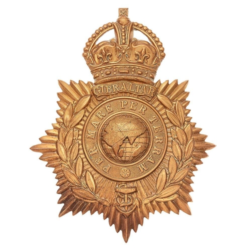 Royal Navy / Royal Marines School of Music helmet plate circa 1902-05.  A good scarce die-stamped brass crowned star bearing laurel sprays and circlet, domed globe to centre. Below the crown a scroll GIBRALTAR, fouled anchor at the base of the wreath. Two loops. VGC (KK 1096)