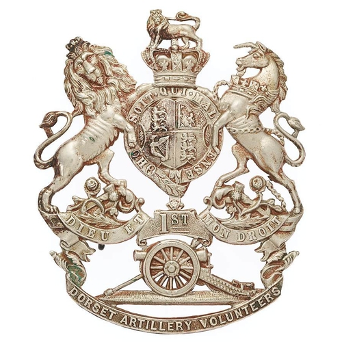 1st Dorset Artillery Volunteers Victorian helmet plate circa 1878-1901.  Good scarce die-stamped white metal Royal Arms on short scroll 1ST over a gun resting on DORSET ARTILLERY VOLUNTEERS scroll.    Three loops  VGC  Formed 29th December, 1859 at Lyme Regis.