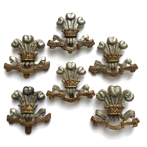 118 - 6 Glamorgan Yeomanry cap badges.  One by Lambourne & Co. Birmingham plus five others unmarked of sev... 