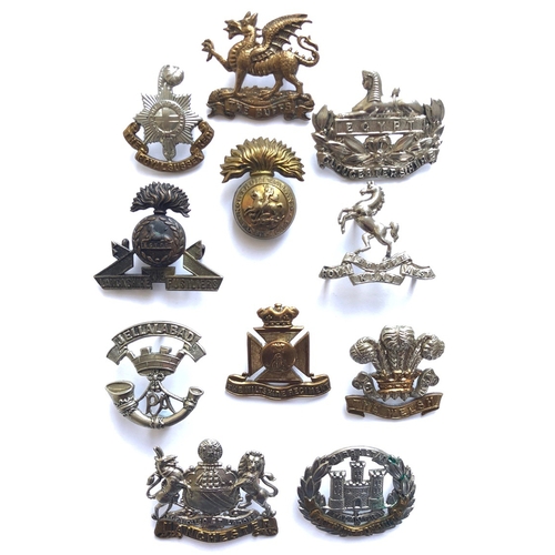 133 - 11 Victorian/Edwardian cap badges.  Royal Sussex ... Buffs ... Gloucester ... Lancashire Fusiliers .... 