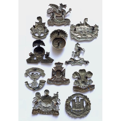 133 - 11 Victorian/Edwardian cap badges.  Royal Sussex ... Buffs ... Gloucester ... Lancashire Fusiliers .... 