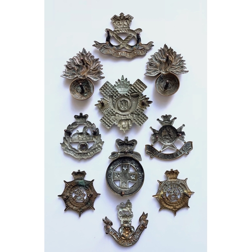 134 - 10 Victorian cap badges.  2 x Royal Fusiliers ... South Staffordshire ... East Lancashire ... Highla... 