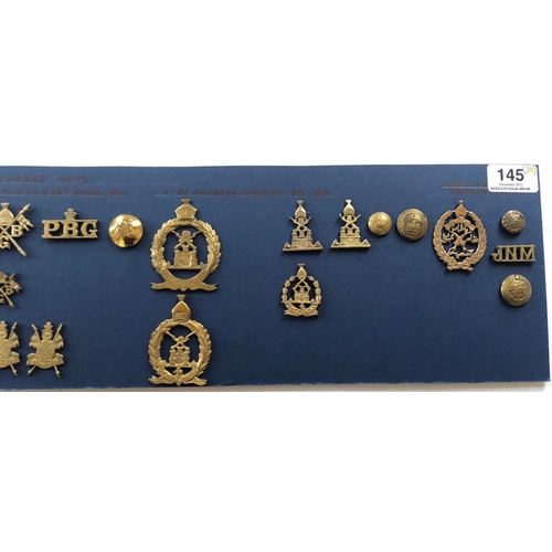 145 - Indian. Hyderabad Army 30 items of insignia.  Good carded selection of Cavalry head-dress and pagri ... 