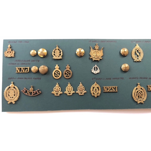 148 - Indian. Hyderabad Army 39 items of insignia.  Good carded selection of Infantry head-dress and pagri... 