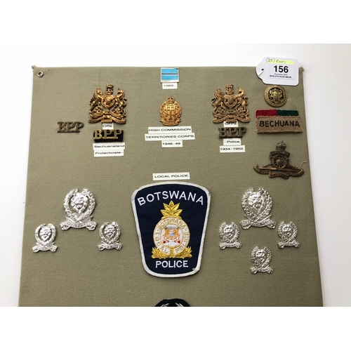 156 - Bechuanaland and Botswana Police and Military 28 items of insignia.  Board with good tabulated displ... 