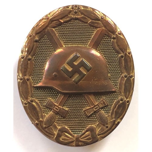 387 - German Third Reich 1939 Wound Badge in gold in case of issue by Friedrich Orth, Wien.  A good die-ca... 