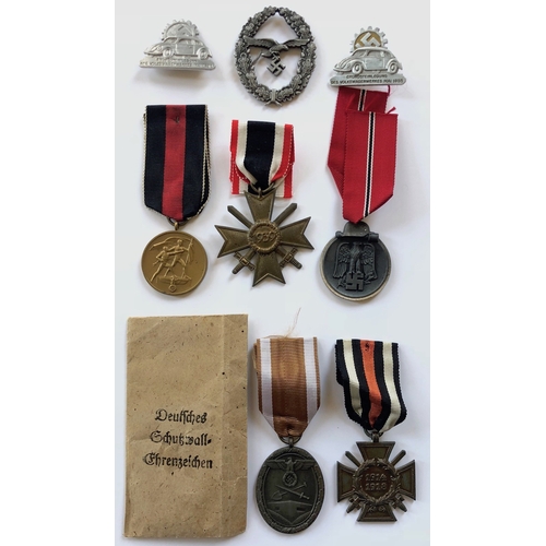 422 - 8 German Third Reich assorted medals and badges.  1939 War Merit Cross, 2nd Class with swords ... Ea... 