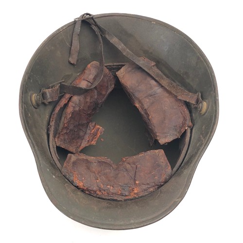 445 - WW1 Imperial German Steel Helmet. A good untouched Great War helmet retaining original green painted... 