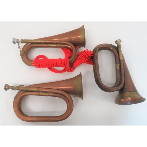 237 - Three Various Military Pattern Bugles
copper and brass bugles complete with mouthpieces.  Two w... 