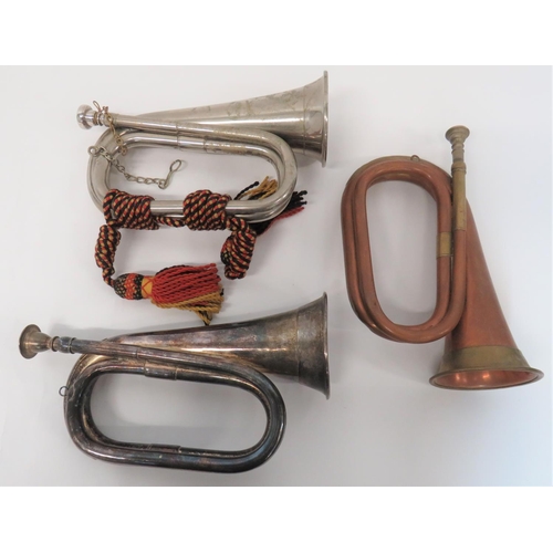 239 - Three Military Pattern Bugles
consisting silver plated example complete with mouthpiece. No apparent... 