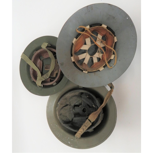 296 - Two MKII Steel Helmets And A Civil Defence Steel Helmet
consisting green repainted helmet.  The... 