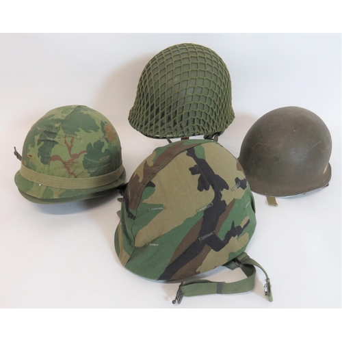 314 - Four Various American Pattern Steel Helmets
consisting green painted outer shell with netting camo. ... 