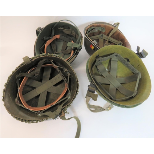 314 - Four Various American Pattern Steel Helmets
consisting green painted outer shell with netting camo. ... 