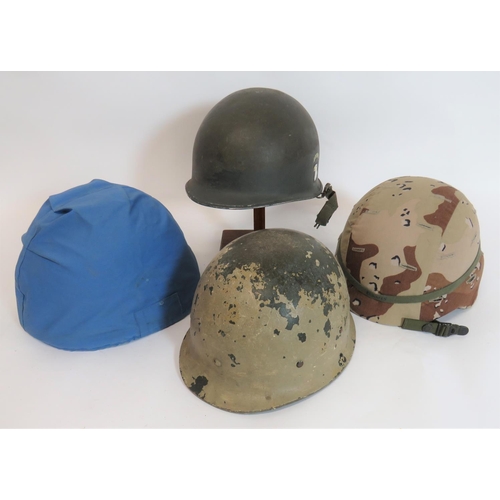 315 - Four Various Helmets Including American
consisting green fibre helmet with desert camouflage cover. ... 