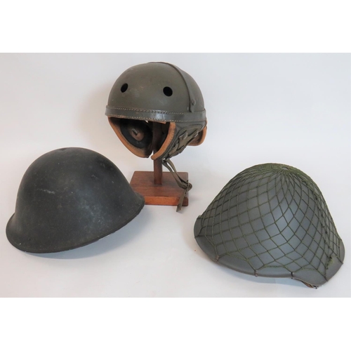 317 - Three Various Helmets
consisting American tank pattern, fibre crown helmet.  Fold down leather ... 