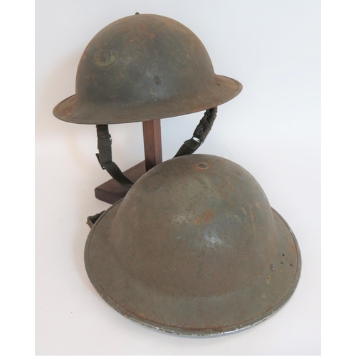 319 - Two WW2 Civil Defence Brodie Pattern Steel Helmets
grey painted crown and brim. One helmet with 3 sm... 