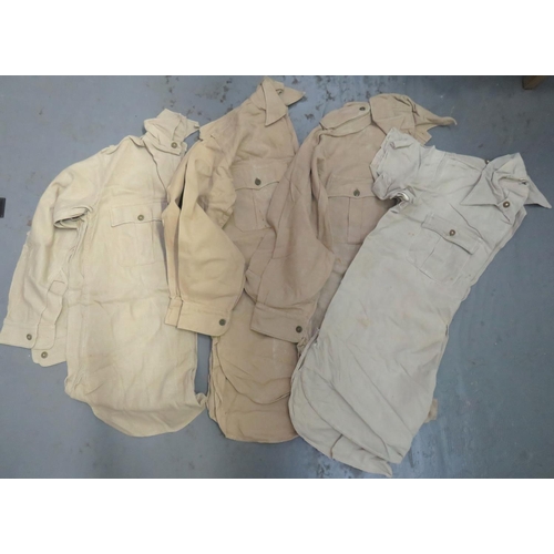 Four Various Tropical Bush Shirts
consisting 3 x khaki tan Aertex, half fastened front shirts with pleated chest pockets ... 1 x similar example with short sleeves.  4 items.
