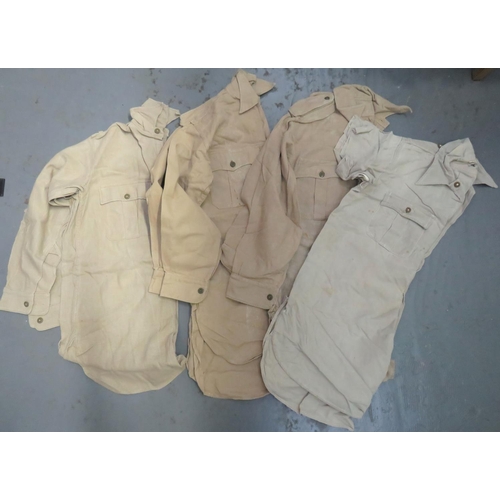 326 - Four Various Tropical Bush Shirts
consisting 3 x khaki tan Aertex, half fastened front shirts with p... 