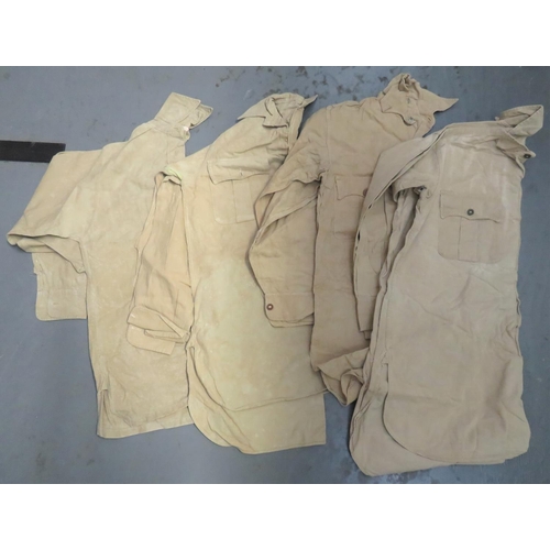 327 - Four Various Tropical Bush Shirts
consisting 3 x khaki tan Aertex, half fastened front shirts with p... 