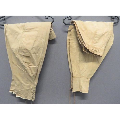 337 - Two Pairs Of Tropical Khaki Breeches
khaki tan cotton, wide leg breeches.  Lower calf securing ... 