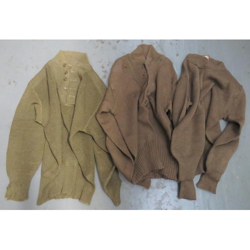 338 - Three American WW2 Pattern Jumpers
2 x green knitted, woollen jumpers.  Short collar.  But... 