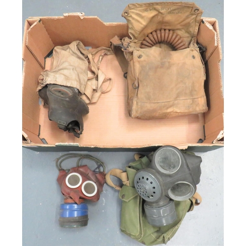 357 - Small Selection of British Respirators
consisting 1939 dated, hose mask complete in transit bag ... ... 