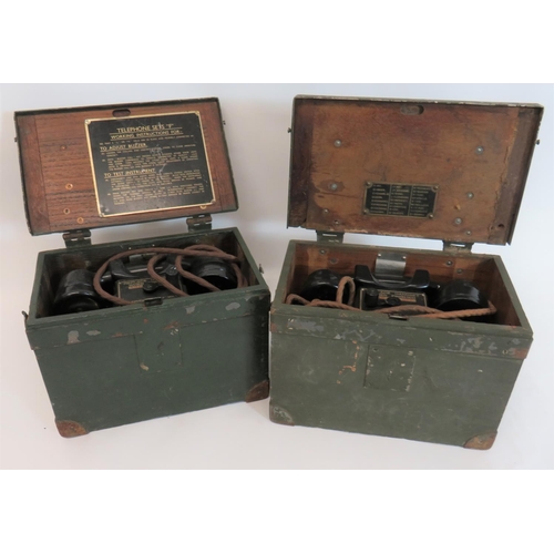 Two WW2 British Field Telephones
green painted, rectangular wooden boxes with reinforced steel corners.  Both containing a pull out telephone set "F" MKI box and handset.  One lid complete with phonetic alphabet.  2 items.