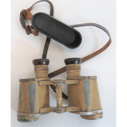 Pair of WW2 German "Dienstglas" Africa Korps Binoculars
adjustable top lenses with Bakelite eye pieces.  Body marked "Dienstglas 6 x 30" with maker "ddx".  All painted in khaki sand colour.  Leather neck strap retaining the composite eye cap cover.  Optics remain clear.  