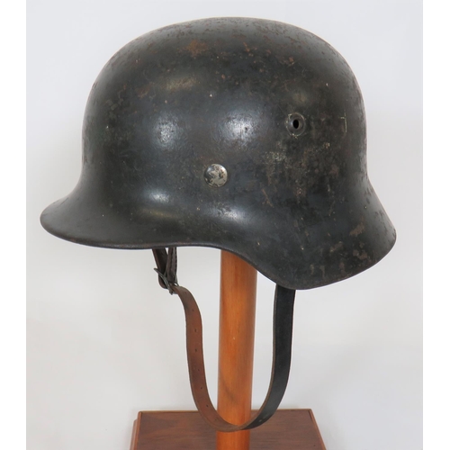 383 - German M1940 Luftwaffe Steel Helmet
dark grey painted steel shell with lower rolled edge brim.  ... 