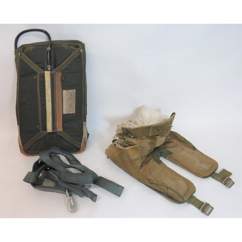 392 - Two Various Parachute Packs
consisting a U shape, continental seat pack.  Green canvas with sid... 