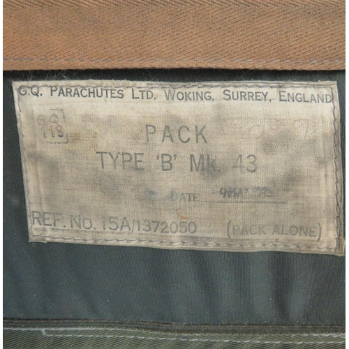 392 - Two Various Parachute Packs
consisting a U shape, continental seat pack.  Green canvas with sid... 