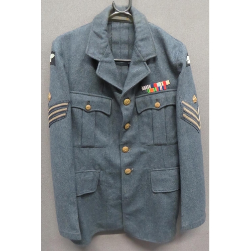 1941 RAF Flight Sergeant Service Dress Tunic
blue grey woollen, single breasted, open collar tunic.  Pleated chest pockets with buttoned flaps.  Lower hidden pockets with plain flaps.  Both arms with bevo weave shoulder eagles and braid Sergeant stripes surmounted by brass crowns.  Left chest with WW2 ribbons including DFM. Traces of half wing removed.  Brass KC RAF buttons.  Inner issue label dated 1941.  