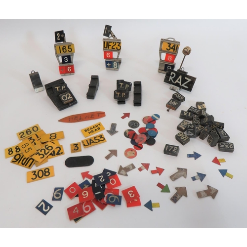 Good Selection of Aircraft Plotting Markers
including 3 x alloy plotting stands ... 6 x various wooden plotting stands ... Various number and letter markers ... Arrow markers ... Coloured disc markers ... Wooden blocks with painted numbers.  Quantity.