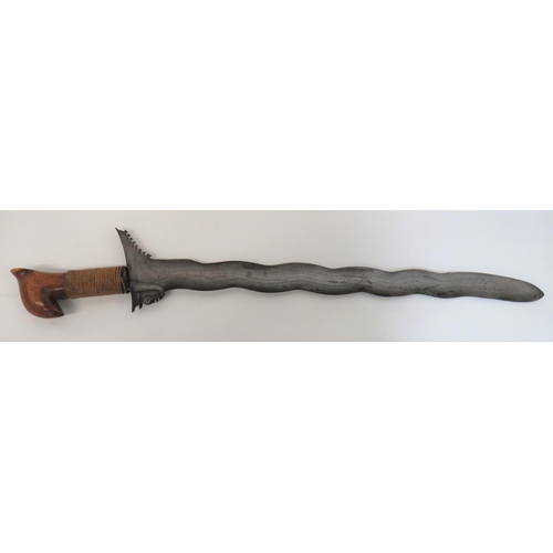 423 - 19th Century Moro Kris
22 inch, wavy edge, wide blade.  Typical flared out forte with chiselled... 