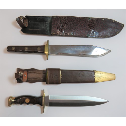 432 - Two modern Bowie KnivesConsisting a clipped point bowie blade with makers details. Brass crossguard ... 