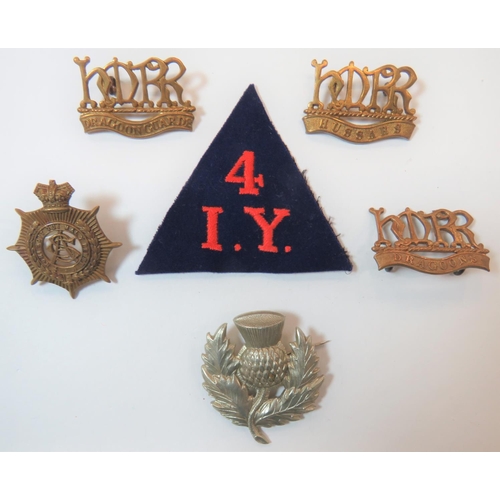 Victorian/Boer War Badges
consisting white metal thistle.  Royal Scottish Reg.  Brooch fitting ... Brass Her Majesty's Reserve Regiment Dragoons ... Similar Dragoon Guards ... Similar Hussars ... Brass Vic crown Army Service Corps ... Red embroidery 4 over IY on blue triangle.  6 items.