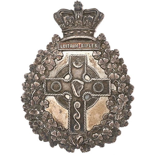 Irish Leitrim Rifles Militia Victorian Officer pre 1881 pouch belt plate.  Fine rare die-cast silvered crown LEITRIM RIFLES tablet surmounting heavy shamrock sprays; centrally a Celtic cross with Harp to centre. Four screw posts; complete with backing plate. VGC        Raised in 1793 at Carrick-on-Shannon as Leitrim Militia, redesignated Leitrim Rifles in 1855 and became 8th Bn. Rifle Brigade on Friday 1st July 1881. Disbanded 31st July 1889. Gordon Cummings Collection.
