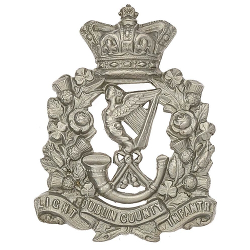 Irish Dublin County Light Infantry Militia Victorian glengarry badge circa 1874-81.  Good scarce die-stamped white metal crowned Union sprays bearing scroll DUBLIN COUNTY LIGHT INFANTRY; Maid of Erin Harp over a strung bugle to voided centre.  Loops. VGC        Raised in 1793 at Lucan as Dublin County Militia, became 5th Bn. Royal Dublin Fusiliers 31st July 1881. Gordon Cummings Collection.