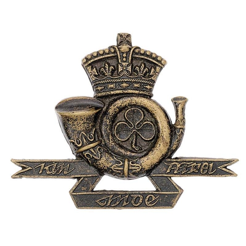 Irish Westmeath Rifles Militia Victorian glengarry badge circa 1874-81.  Good scarce die-stamped blackened brass crowned curled bugle horn with shamrock to centre, all resting on straight tri-part Gaelic scroll. Three loops. VGC        Raised in 1793 at Mullingar as Westmeath Militia, redesignated Westmeath Rifles in 1855 and became 9th Bn. Rifle Brigade on 1st July 1881.Gordon Cummings Collection.