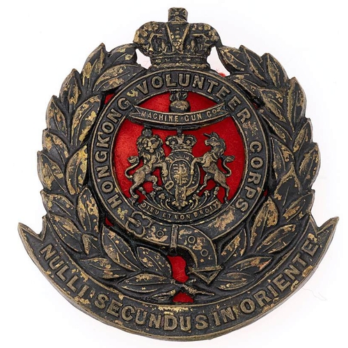 96 - Hong Kong Volunteer Corps Victorian Machine Gun Co. helmet badge circa 1893-1902.  Good rare die-sta... 