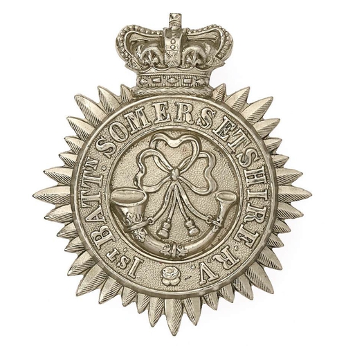 1st Bn. Somersetshire  Rifle Volunteers Victorian glengarry badge circa 1880-95.  Good scarce die-stamped white metal multi rayed star bearing crowned circlet 1ST BATTN.SOMERSETSHIRE R.V.; ornate strung bugle to finely seeded centre. Toned loops. VGC        Bob Betts Collection