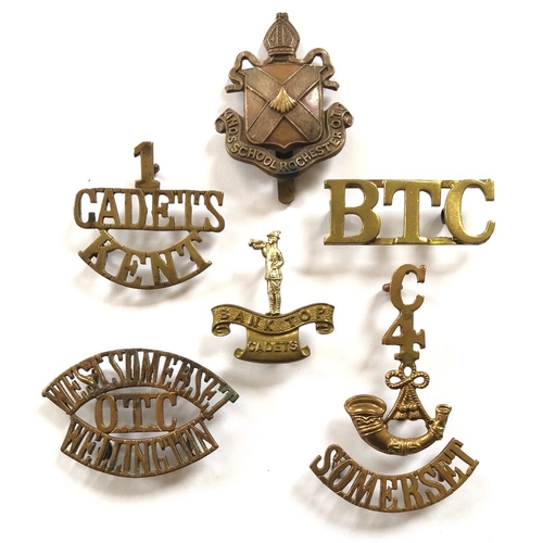 6 items of Cadet insignia.  Kings School Rochester OTC cap badge ... 1/CADETS/KENT title ... Bank Top Cadets cap badge ... BTC title ... WEST SOMERSET / OTC / WELLINGTON title ... C / 4 / bugle / SOMERSET two part title. All complete with sliders or loops.        Bob Betts Collection