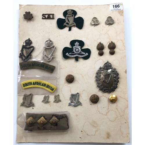 166 - South African Irish 21 various items of insignia.  Includes head-dress badges, large Piper head-dres... 