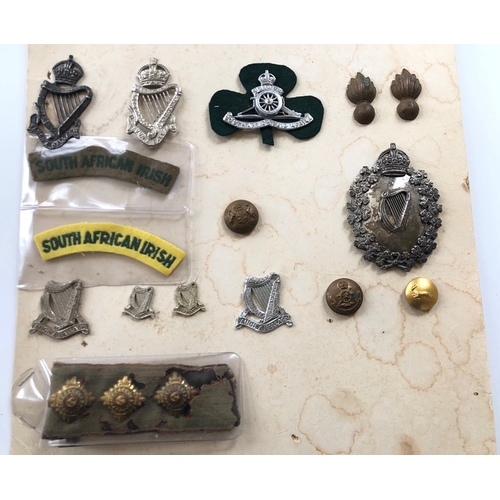 166 - South African Irish 21 various items of insignia.  Includes head-dress badges, large Piper head-dres... 