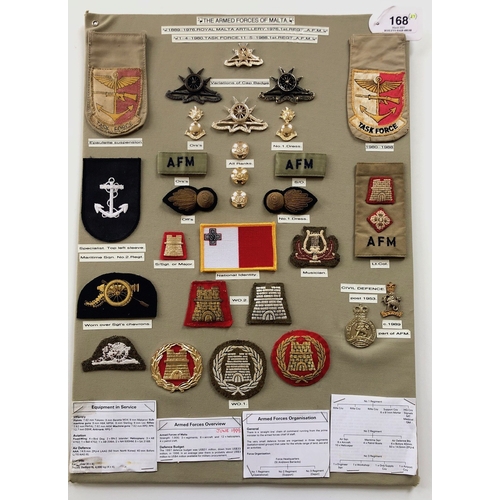 168 - Malta Armed Forces 29 items of insignia.  Board with good display of metal and cloth badges. Most co... 