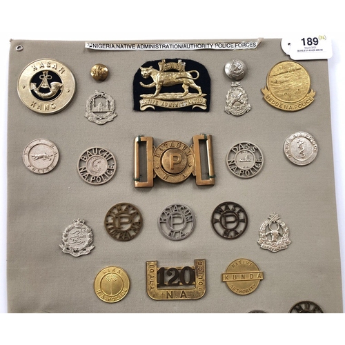 189 - Nigeria Native Administration 36 items of insignia.  Board with good display of metal and cloth badg... 