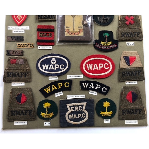 190 - West African Formations 33 items of insignia.  Board with good display of metal and cloth badges. Mo... 