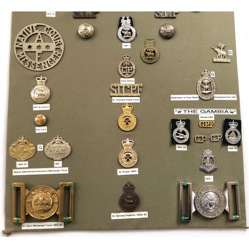 192 - Sierra Leone Police etc. 35 items of insignia.  Board with good display of metal and cloth badges an... 